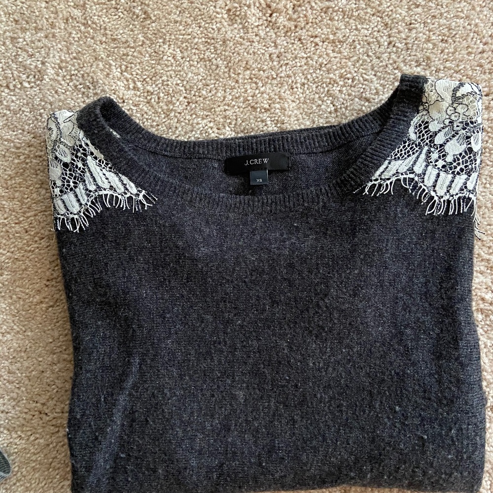 Dark grey sweater with woven ivory lace sleeves